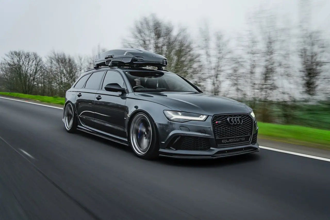 Grey Audi RS6 Avant with Aphero AF-6 wheels driving on a wet road